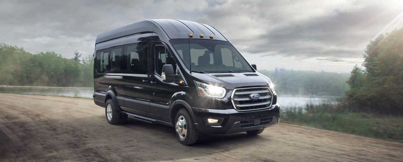 Black Executive Ford Transit Passenger Van | Beautiful Outdoor Country Road Photo Image | Aspen Limo Minneapolis MN